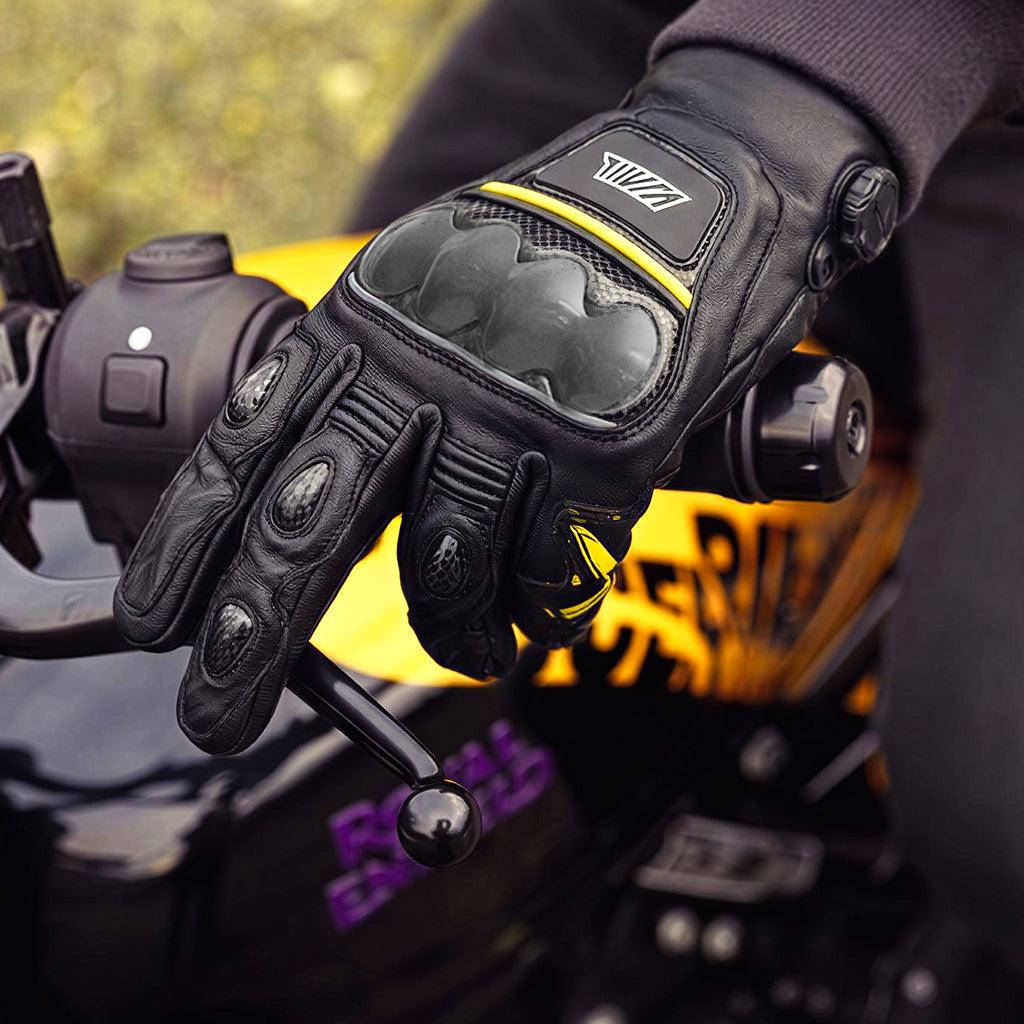 Black motorcycle glove with brand logo on a motorcycle handlebar